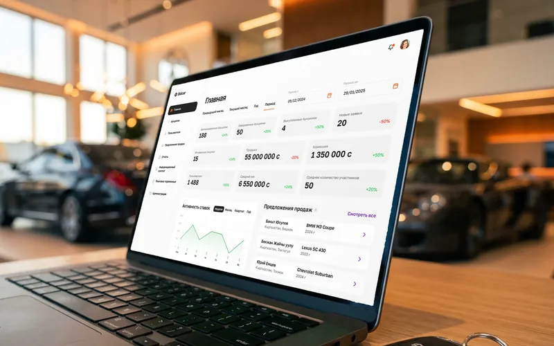Bidcar auction admin panel on a laptop in a car showroom